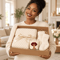Woman holding Shh Lips self-care gift box — Bordeaux lips candle, ivory blanket and cozy socks