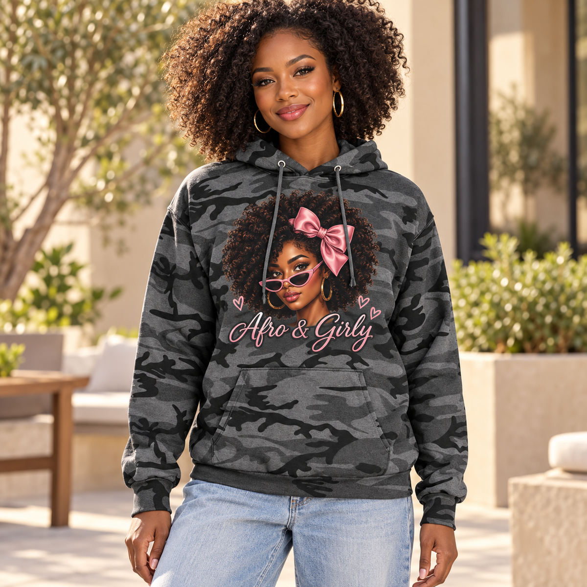 Illustrative adult woman wearing Afro & Girly Black Heather Camo hoodie