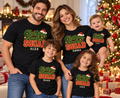 Family of five wearing black personalized Christmas shirts and baby bodysuit — example names