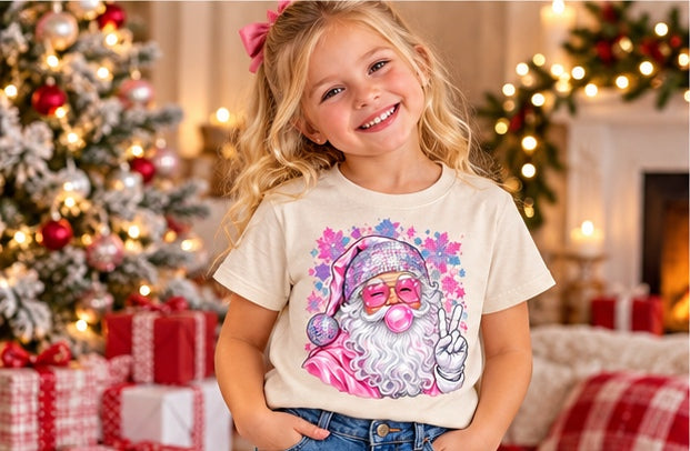 Little girl wearing a natural pink Santa Christmas T-shirt