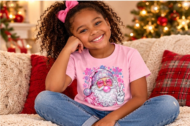 Little girl wearing a pink-seated pink Santa Christmas T-shirt