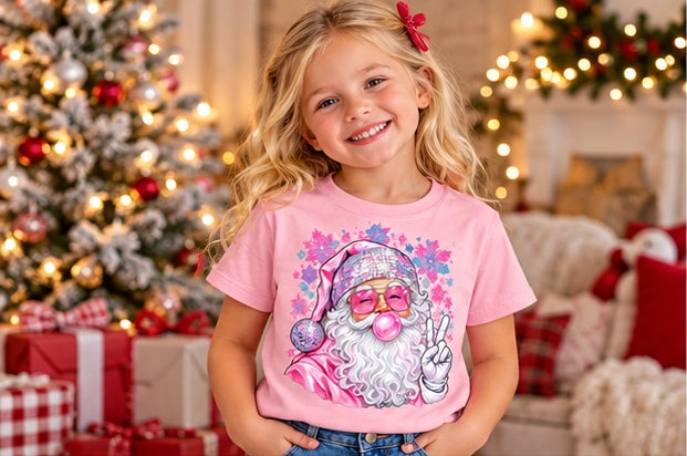 Little girl wearing a pink pink Santa Christmas T-shirt