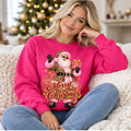 Woman wearing heliconia leopard Santa Merry Christmas sweatshirt