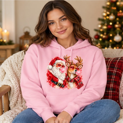 Woman wearing light-pink Santa and reindeer bubblegum Christmas hoodie