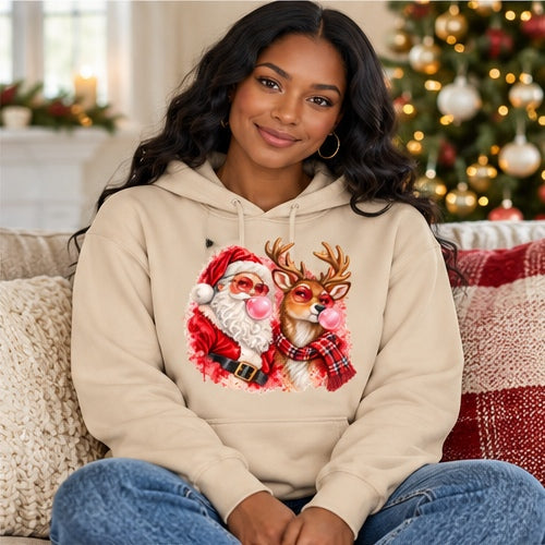 Woman wearing sand Santa and reindeer bubblegum Christmas hoodie