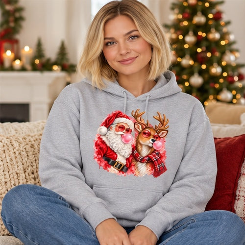 Woman wearing sport-grey Santa and reindeer bubblegum Christmas hoodie