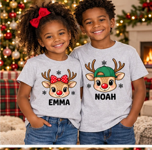 Children wearing ash personalized reindeer head T-shirts. Each tee sold separately; names shown are samples.
