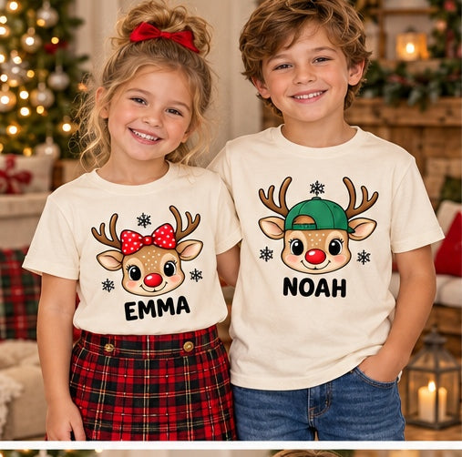 Children wearing natural personalized reindeer head T-shirts. Each tee sold separately; names shown are samples.