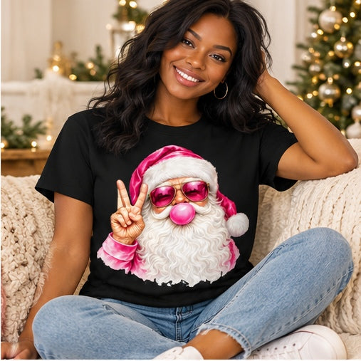 Seated woman wearing a black pink bubblegum Santa T-shirt