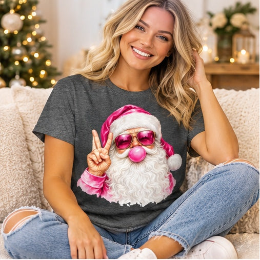 Seated woman wearing a dark-heather pink bubblegum Santa T-shirt