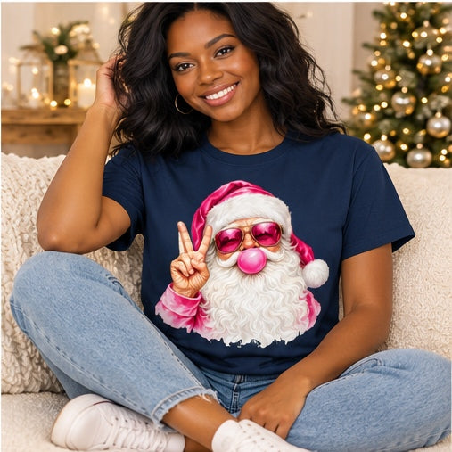 Seated woman wearing a navy pink bubblegum Santa T-shirt