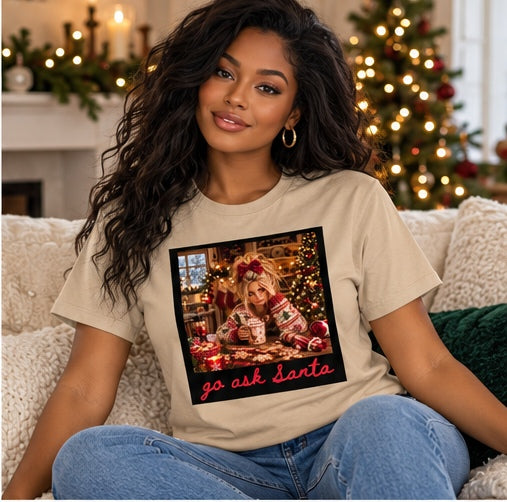 Woman wearing a sand Go Ask Santa Christmas T-shirt