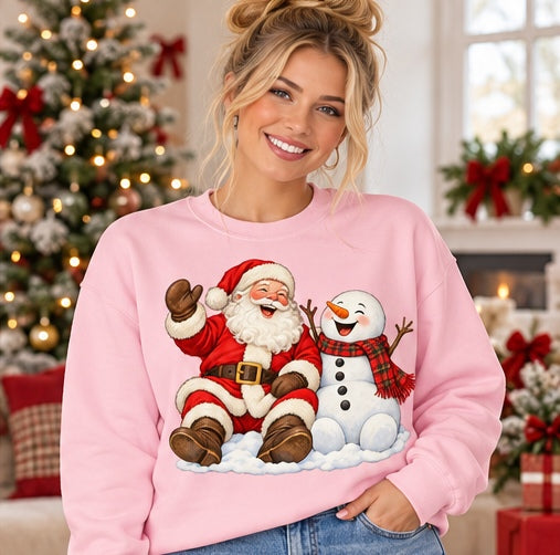 Woman wearing a pink Santa and snowman Christmas sweatshirt