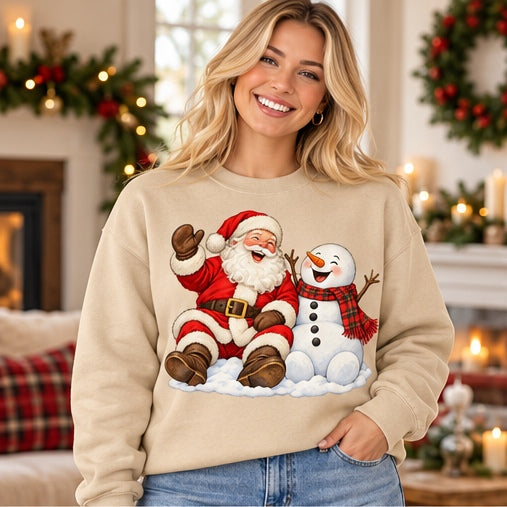 Woman wearing a sand Santa and snowman Christmas sweatshirt