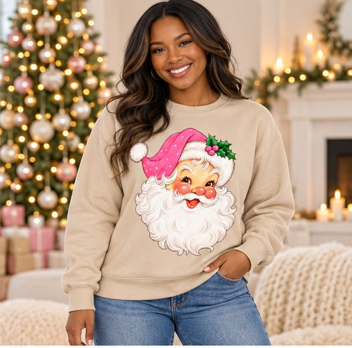 Woman wearing a sand vintage pink Santa sweatshirt